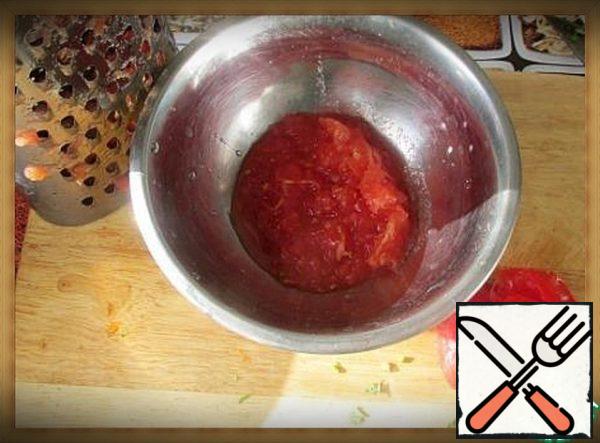Cut the tomatoes in half and grate the skin out so that it remains in your hand.