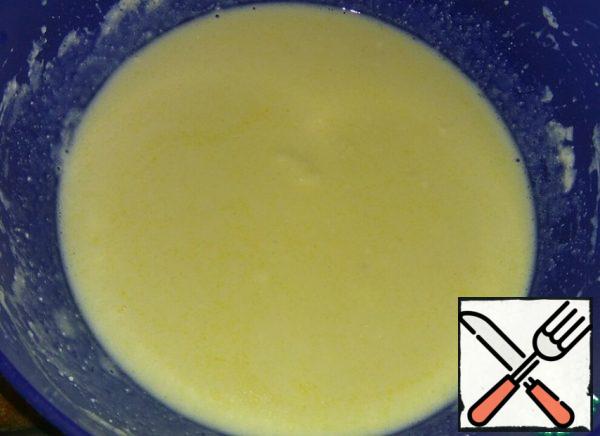 Add warm milk and melted butter and mix.