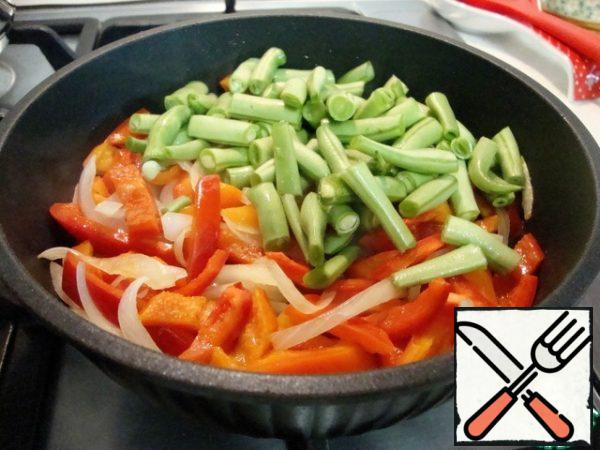 Add the beans. Stir and fry until half cooked.