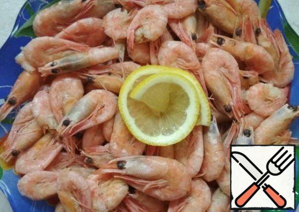 Clear the shrimps from their shells. Do not cook. You can lightly flavor with lemon juice for flavor.