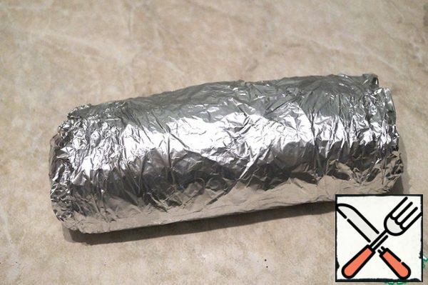Wrap tightly in 2 layers of foil. Bake the meat in a preheated 200 degree oven for 1 hour. For 10 minutes until ready, open the foil so that the meat is browned.