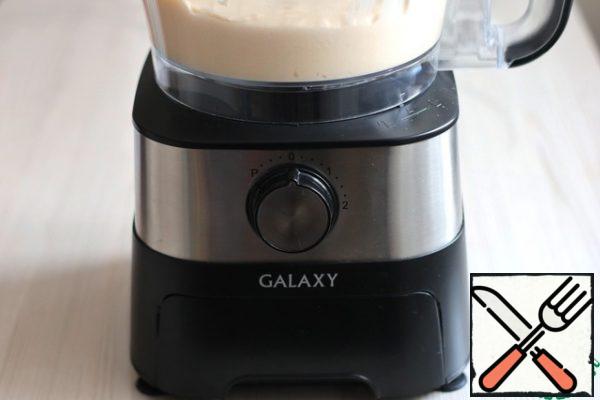Gradually, in portions, put all the dry ingredients into the bowl of the food processor, alternating them with the addition of kefir (250 ml.). Whisk the mixture.