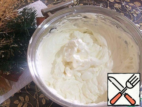 Add the curd cheese and vanilla to the whipped cream and whisk for another couple of minutes.