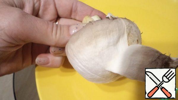 Lightly wipe the mushrooms with a damp cloth or as I remove the skin from them.