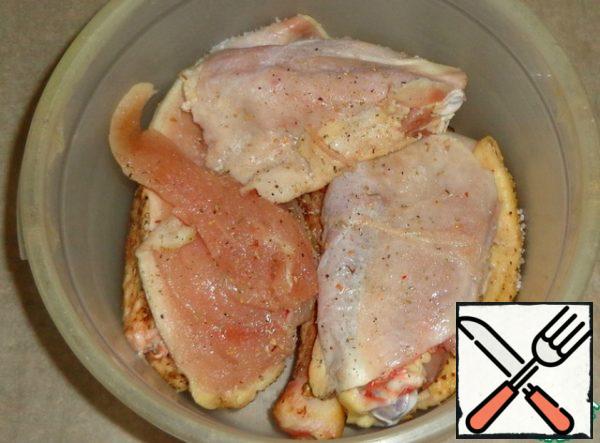 Put the chicken pieces in a deep dish, add salt and seasoning.