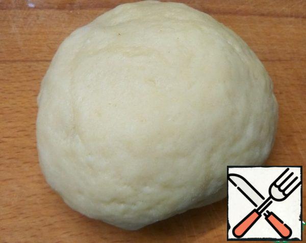 Add flour and baking powder in parts. Knead a soft, non-sticky dough.