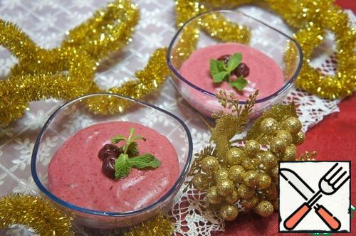 Pour the mousse into molds or glasses and send it to the refrigerator for 3-4 hours to freeze. Decorate the finished mousse with cherries and mint leaves.