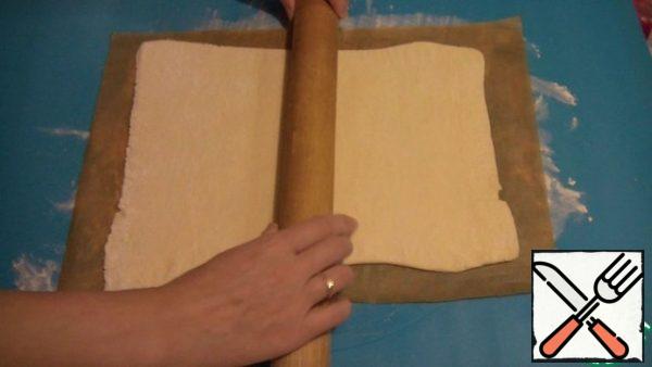 Roll out one layer of dough into a rectangle about 3-5 mm thick.