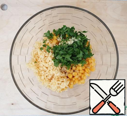 Add corn, parsley with garlic and cheese. Stir.