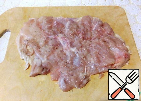 Cut the bone from the hams, leaving the meat on the skin. Lightly salt and pepper, beat through the film with the smooth side of a hammer or rolling pin.