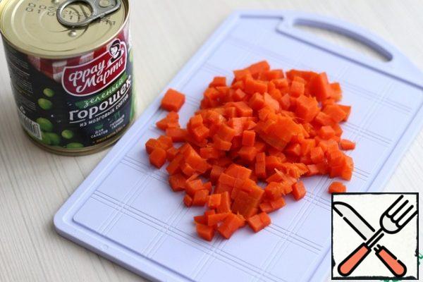 Boil the carrots and cut them into small cubes.
