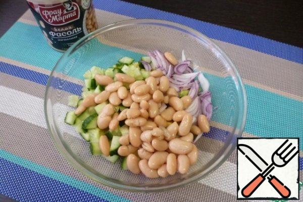 Add canned beans to the vegetables.