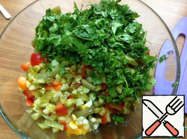 Chop the greens, squeeze out the garlic and add to the salad, add a little salt.