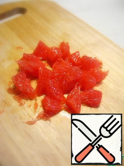 Peel and slice the grapefruit.