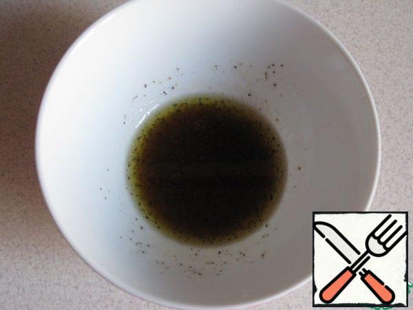 For the dressing, mix the olive oil, soy sauce and the juice of half a lemon. Add salt and pepper to taste.