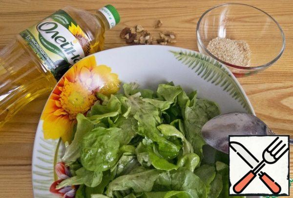 Add the salad leaves to the dressing and mix.