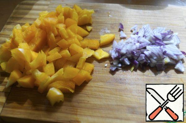 Cut the bell pepper into small pieces and chop the onion.