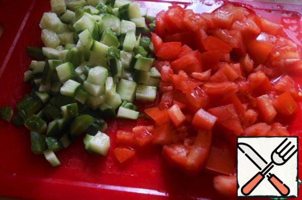 Cut the cucumber and tomato into small cubes.