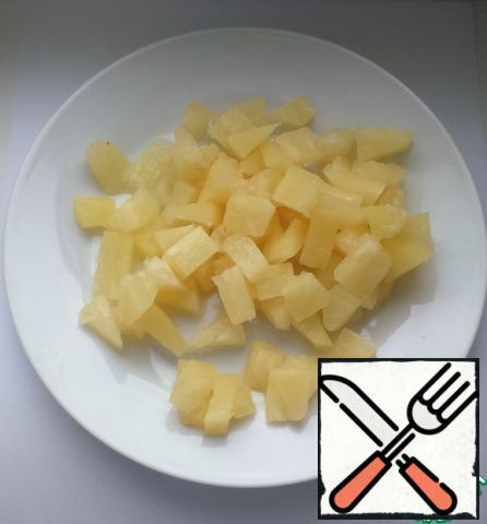 Slice the pineapple.