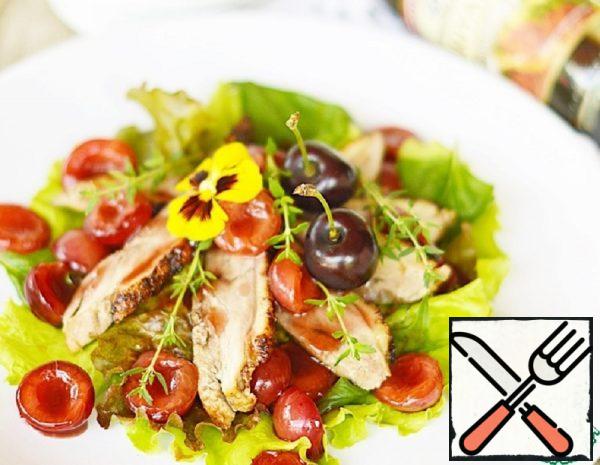 6. Place the slices of duck and cherry on top.