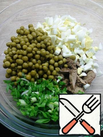 Add the peas and green onions.