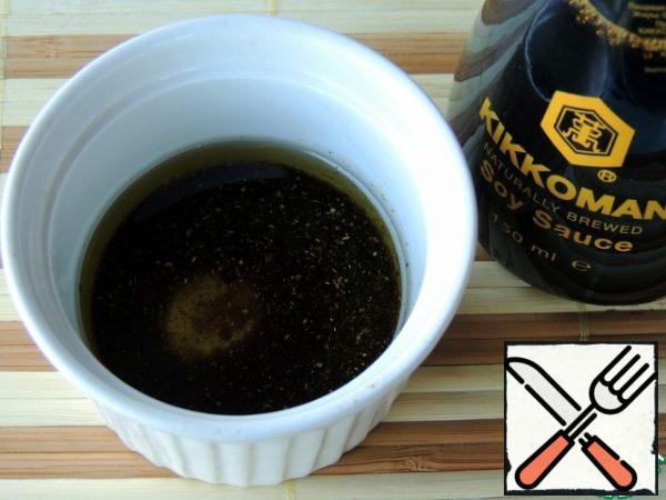 For dressing, mix soy sauce, oil and pepper.