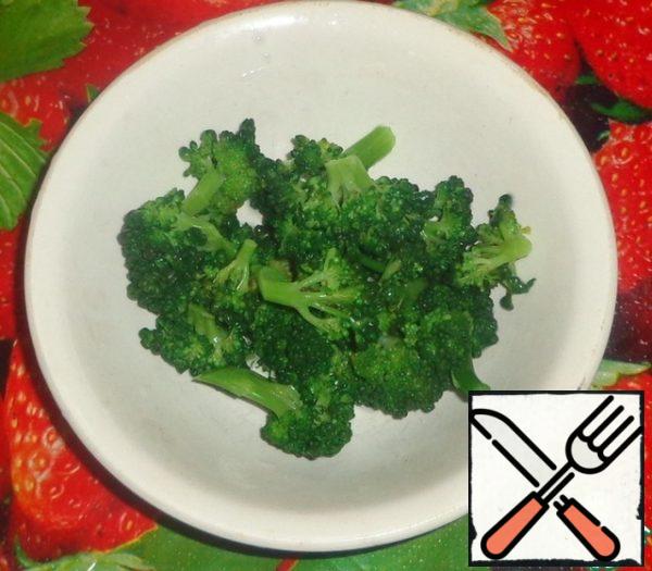 Boil the broccoli in water for about 5 minutes . Then rinse in cold water.