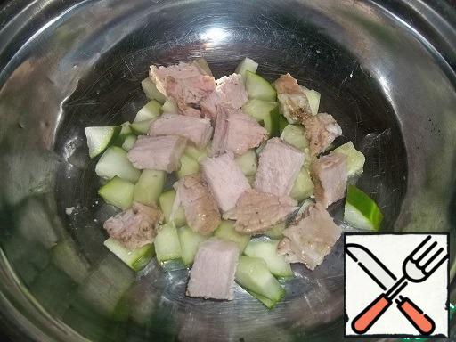 Cucumber and meat (any or chicken) cut into not too small cubes.