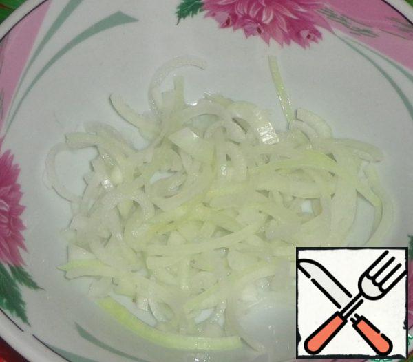 Onion cut into half rings.
I poured boiling water over the onions to remove the sting.