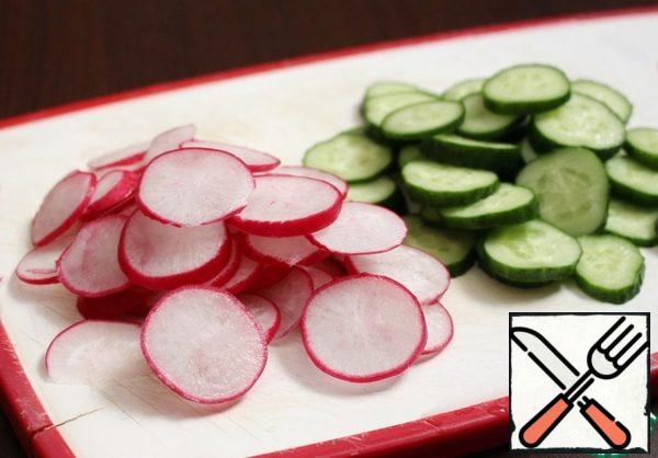Cucumber and radish cut into thin circles.