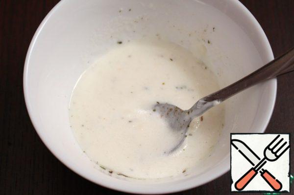 Mix the yogurt with olive oil, chopped garlic, salt, pepper and mint.