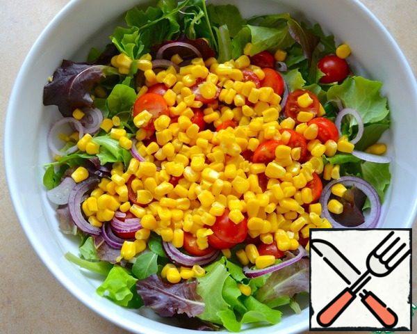 Add the canned corn to the bowl.