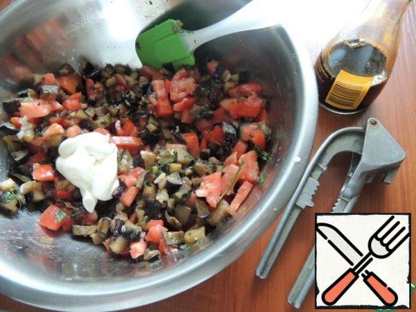Combine eggplant with tomatoes, add garlic, herbs, mayonnaise and soy sauce. Gently mix.