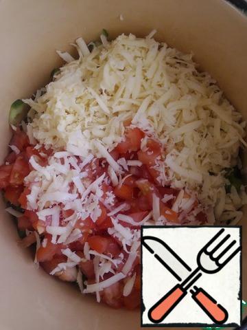 Grate the cheese on a medium grater. Cut the tomatoes finely into a separate plate. Let them stand for 5 minutes , drain the juice and add to the salad.