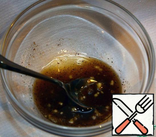 Mix the soy sauce, sugar, grated fresh ginger, black pepper, rice vinegar and oil for the dressing .