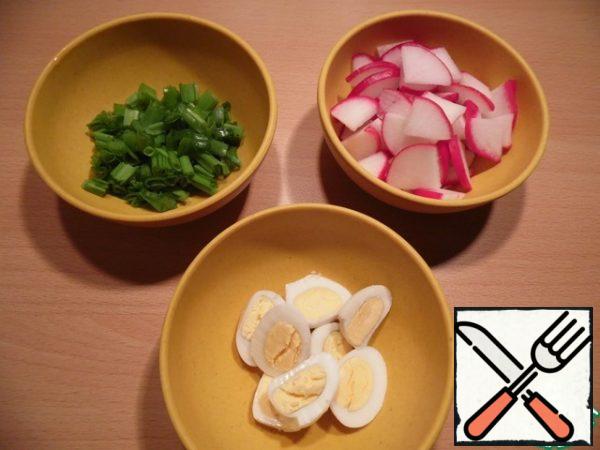 Boil the eggs, cut into halves , chop the onion, and cut the radish into small pieces. Mix all the ingredients and season with melted butter.