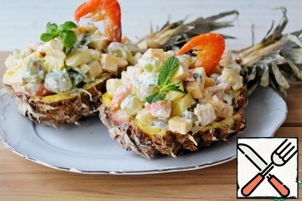 Put the salad in the prepared pineapple boats, garnish with shrimp.