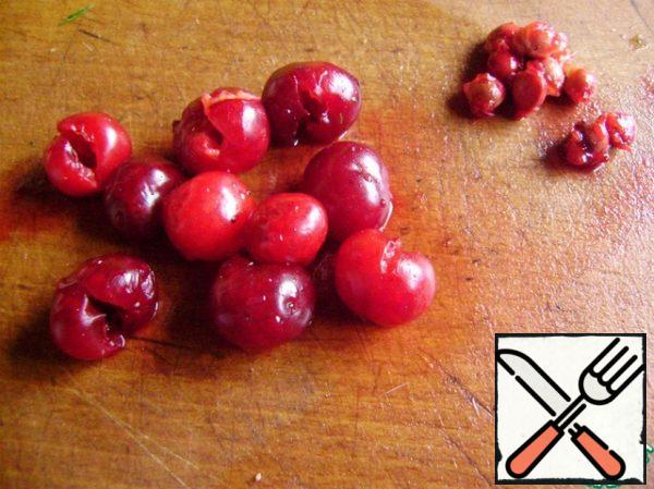 Carefully remove the seeds from the cherries.