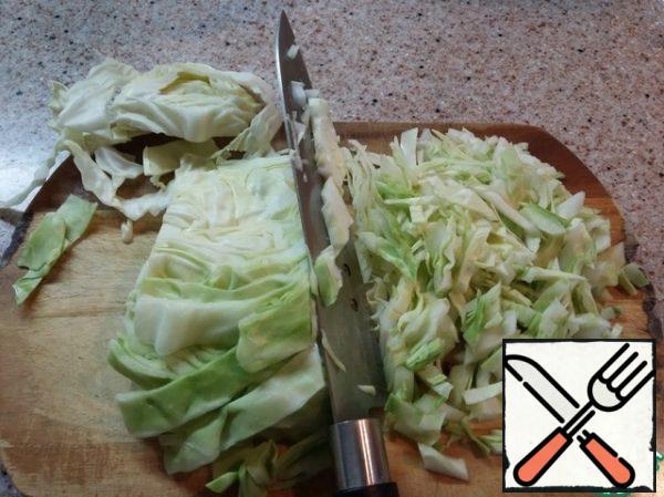 Wash the cabbage and chop it finely.