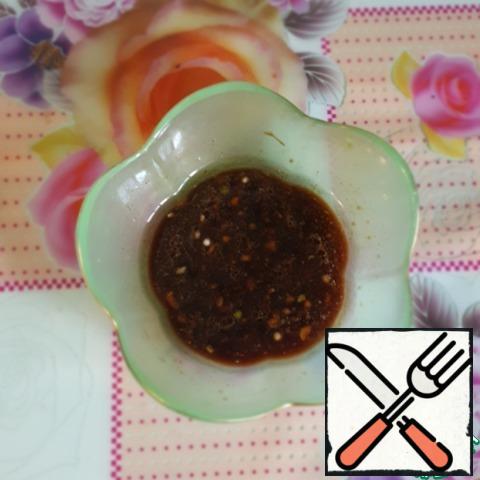 For dressing, mix soy sauce, vegetable oil, lemon juice and garlic, add black pepper to taste.