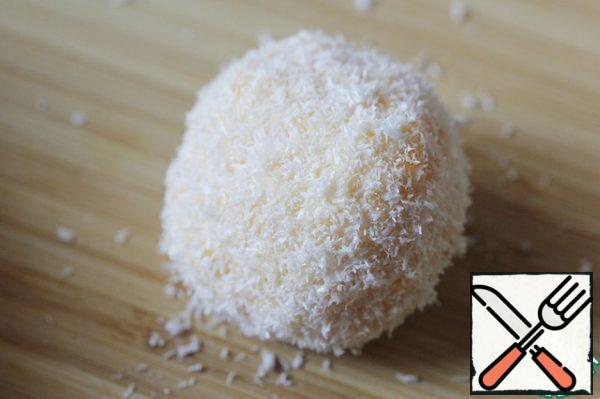 Roll each ball in coconut chips.
Let the finished balls stand in the refrigerator for a while, then serve to the table.
I do not recommend storing this snack for more than 12 hours.