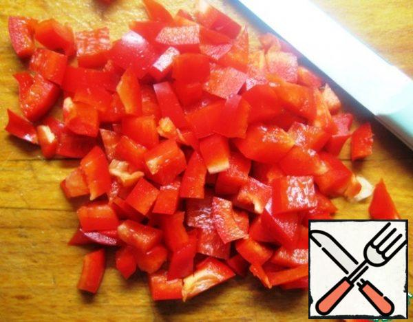 Cut the bell pepper into small pieces .