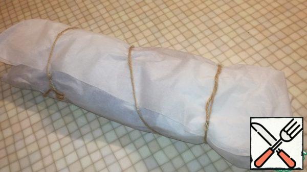 Wrap it well in parchment paper. I do it in two layers. And tie it with twine.