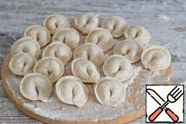 Place the dumplings on a floured board and put them in the freezer for an hour and a half (or cook immediately).