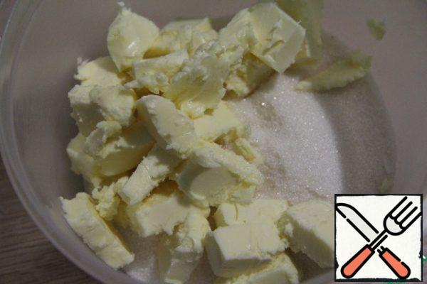 Beat the softened butter with the sugar.