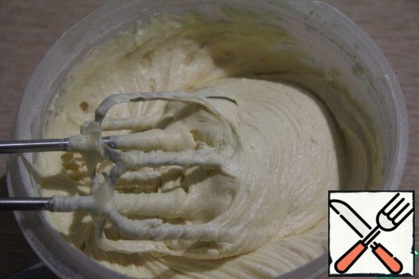 Add to the butter mixture (in two steps), alternating flour and curd-milk mixture. And also, the zest from three lemons. Mix everything well.