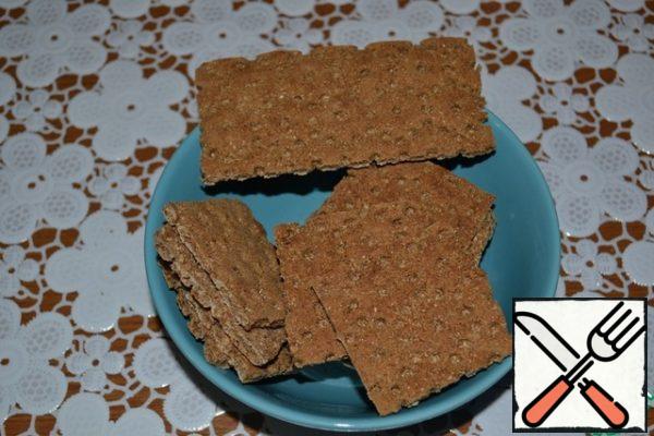 Cut the bread in half. From 12 pieces, you should get 24 parts. I have loaves, the size of 12*6 cm, so I got squares of 6*6 cm.