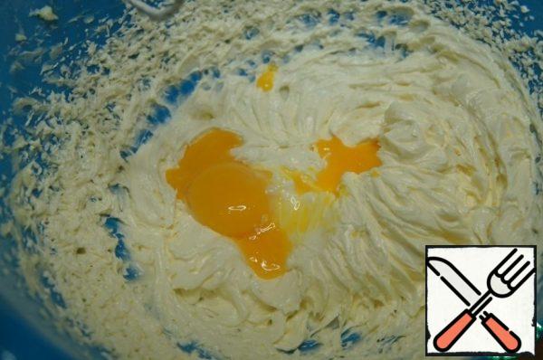 Add the egg yolks. Mix again with a mixer.