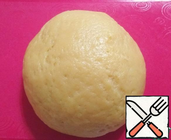 Then add the flour with baking powder in parts to the resulting mass. Knead a soft dough.