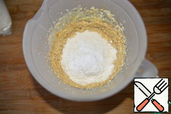 Add the starch, flour, baking powder , and knead the dough.
